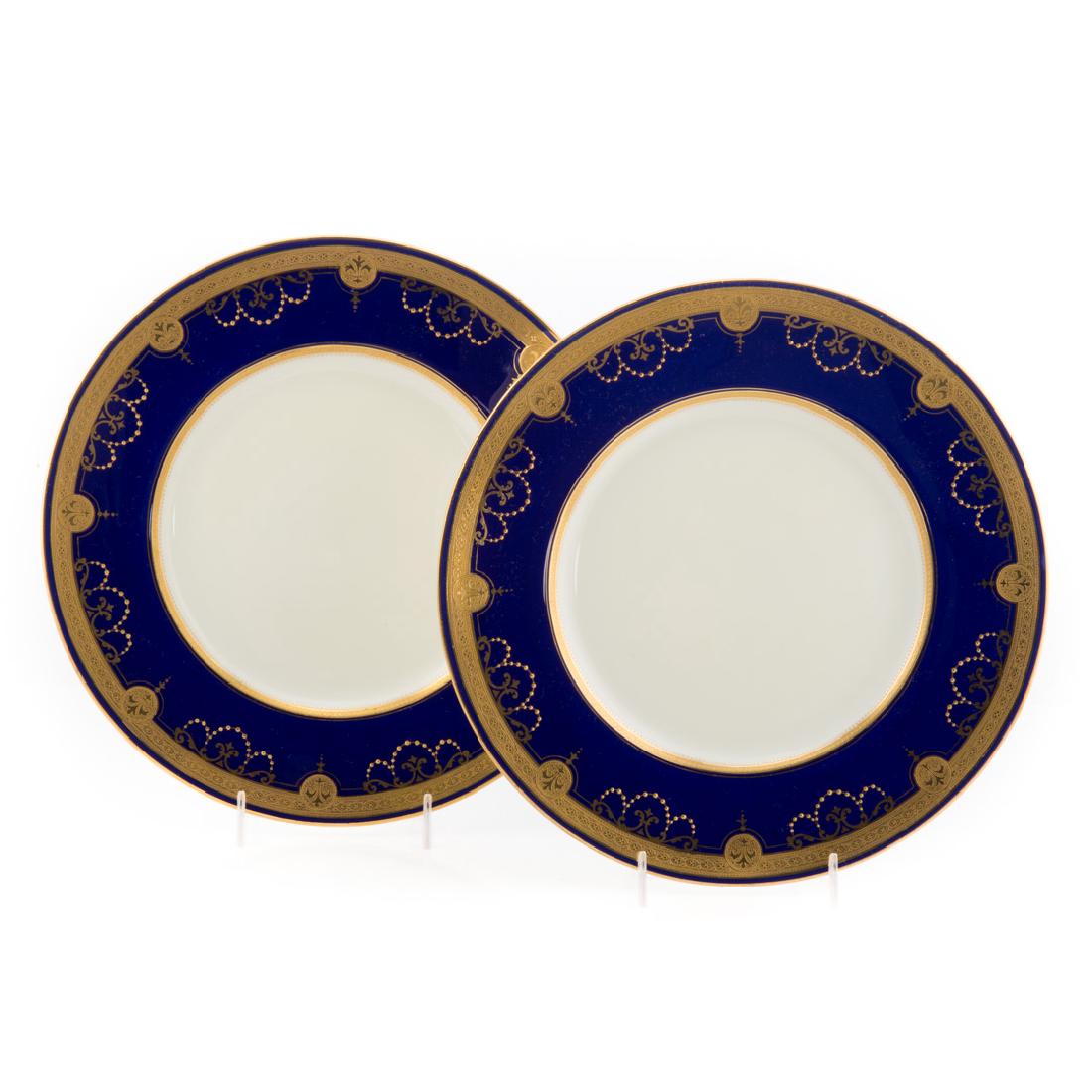 12 Minton cobalt banded cabinet plates: with raised gilt decoration, retailed by Tiffany & Co., 10 1/4 in. Diam.