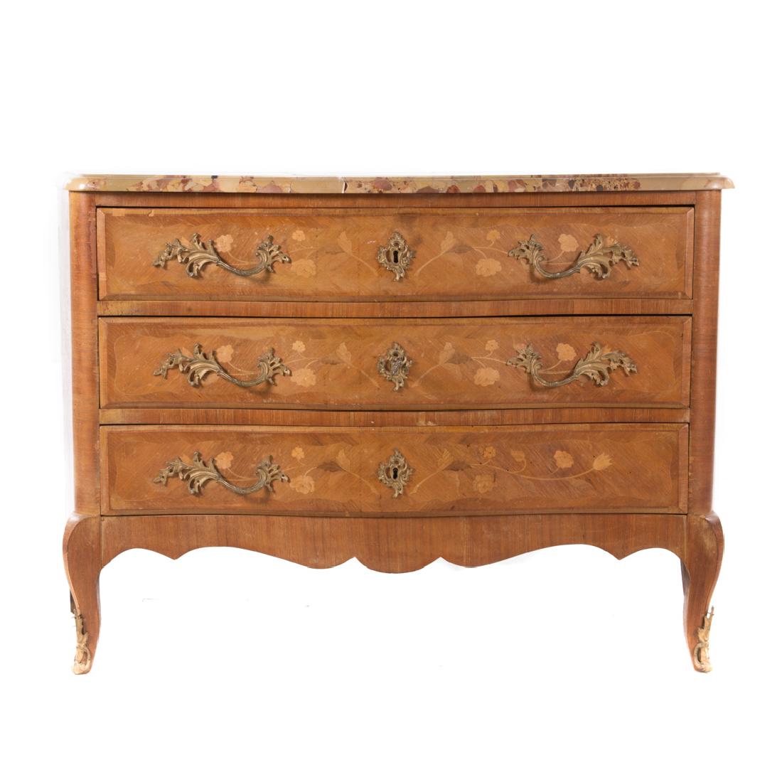 Louis XV style marquetry commode: early 20th century; serpentine breccia marble top, bombe case with floral marquetry inlaid and three shaped drawers, case brass mounts, 32 in. H., 47 1/2 in. W., 20 1/2 in. D.