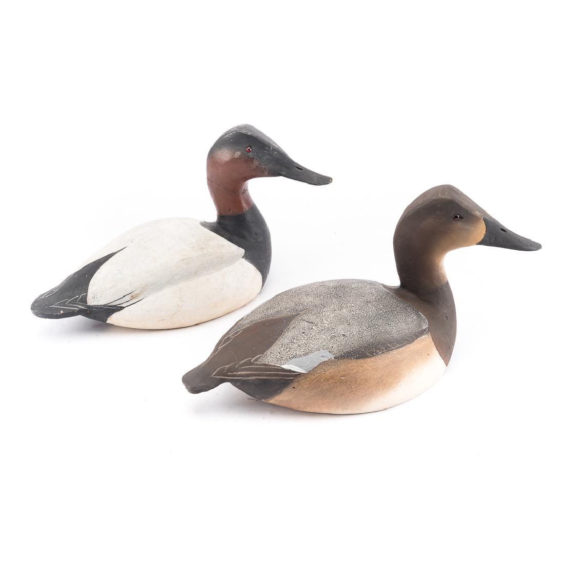 Pair Ward Brothers canvas back working duck decoys: "1936 Style," carved and painted wood hen and drake, hen signed in pen, "L.J. Ward - Bro. Crisfield Md. Lem-Steve Ward 1936," 7 in. H., 15 in. L. and drake "Ward Bro. Crisfield MD Lem-Steve 1940," 8 i