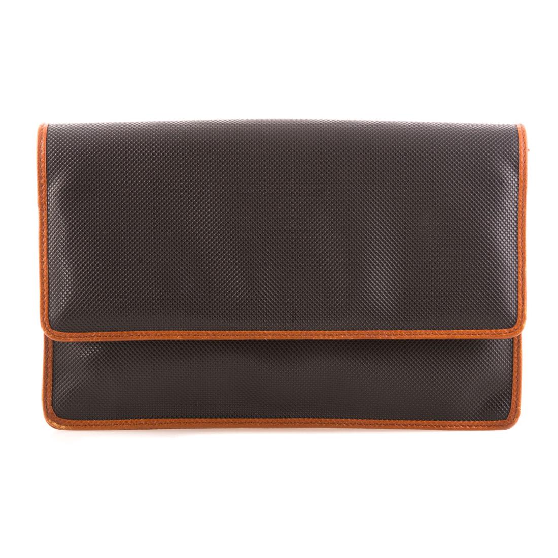 A Vintage Bottega Veneta Leather Clutch: In black pebble leather with brown contrast piping, with convertible shoulder strap, and zipper closure on interior wall. Measuring: height: 6.5", length: 10.5, width: 2.25".