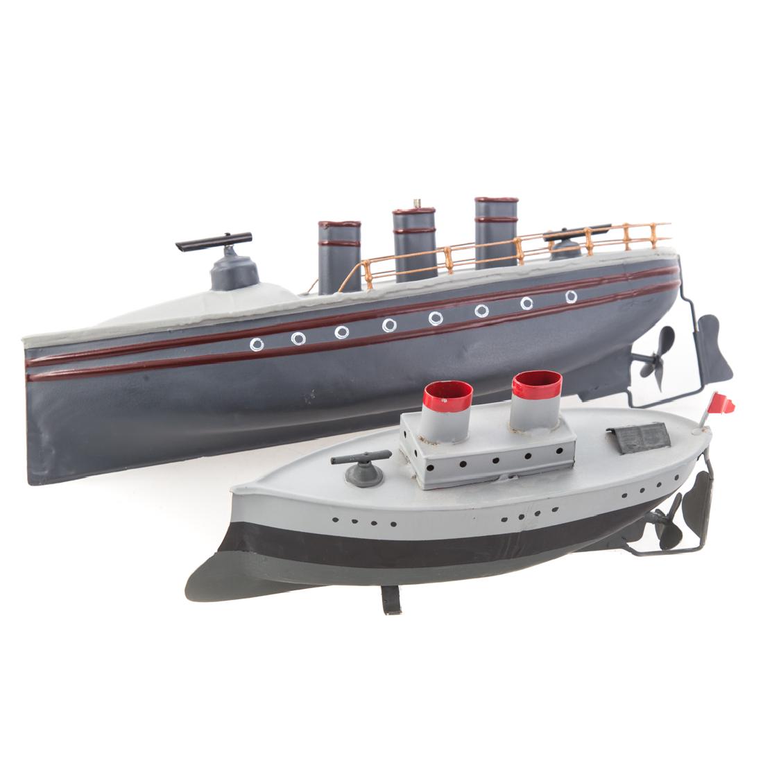 Carette torpedo boat and Fleischmann gunboat: Carette tinplate clockwork torpedo boat with three stacks and twin torpedo launches, 11 1/2 in. L., and Fleischmann tinplate coastal gunboat, twin stacks and bow gun, 7 in. L.
