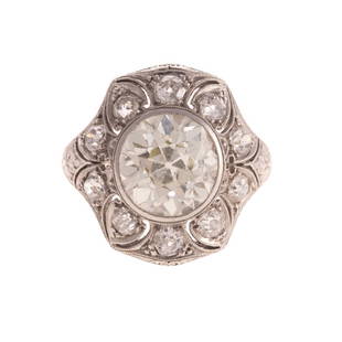 A Lady's 4.51 Diamond Art Deco Ring in Platinum: c. 1910 Art Deco platinum diamond ring featuring an Old European cut diamond measuring 10.2 x 9.8 x 6.7mm weighing approx. 4.51 ct bezel set in the center of the ring with 10 additional Old European c