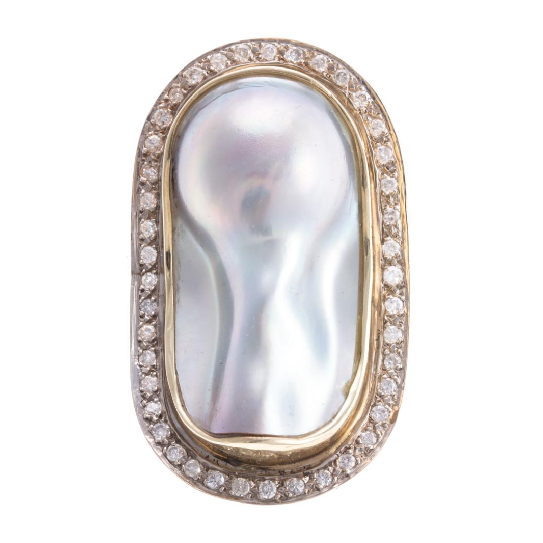A Custom Made Keshi Pearl & Diamond Pin: 14K yellow gold custom made pin featuring silver grey oval Keshi pearl bezel set in the center with 42 full cut diamonds weighing approx. 1.50ctw bead set in a halo around the pearl, 18K yellow gold d