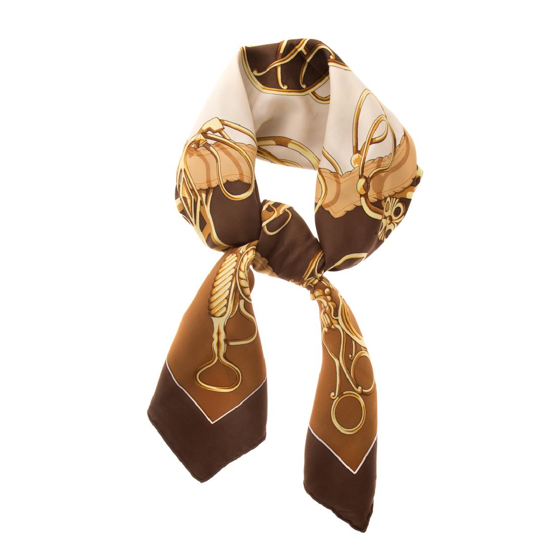 A Hermès Brown & Gold Scarf 90: Brown and gold Hermès 90 cm silk scarf with gold carriage hardware motif and hand rolled edges.