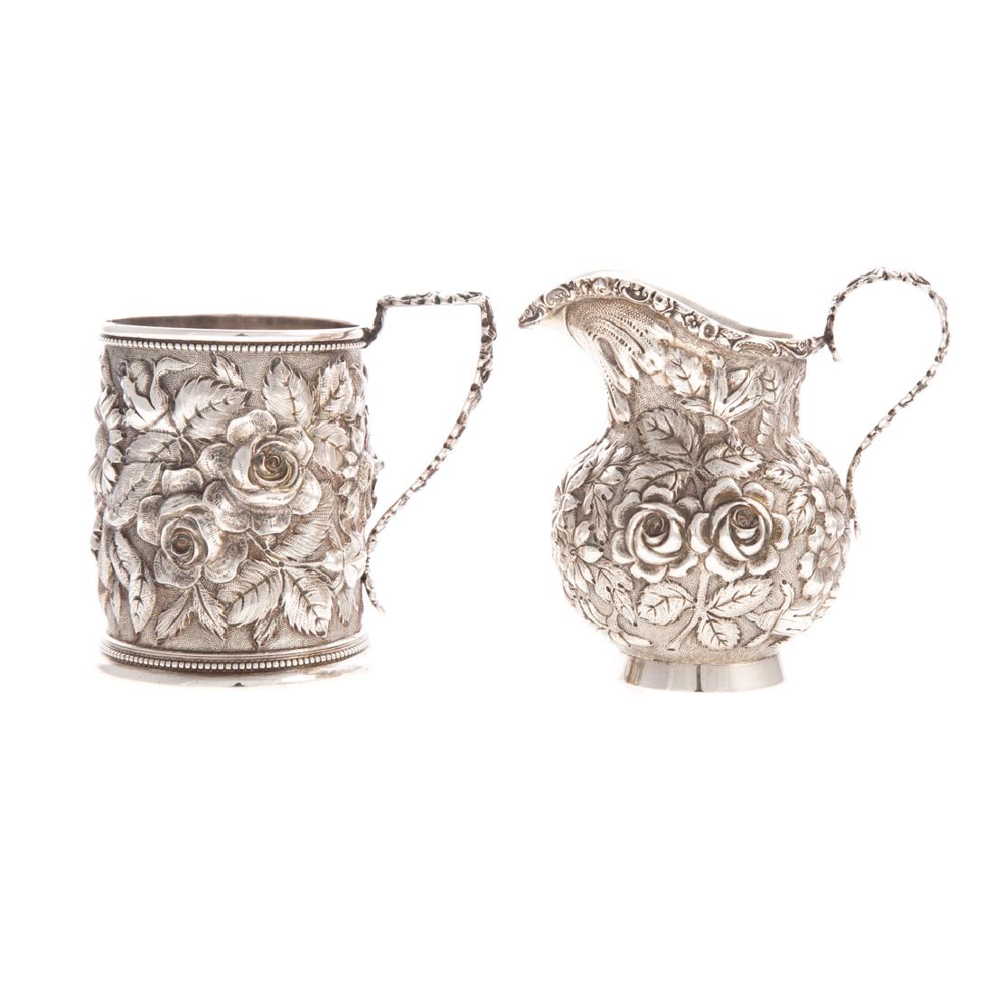 Stieff "Rose" sterling mug and creamer: first quarter-20th century, mug model 131A, 1920 date mark, 3 5/8 in. H. over handle, and creamer model 26, 1925 date mark, 3 7/8 in. H. over handle; 9.60 ozt. t.w.