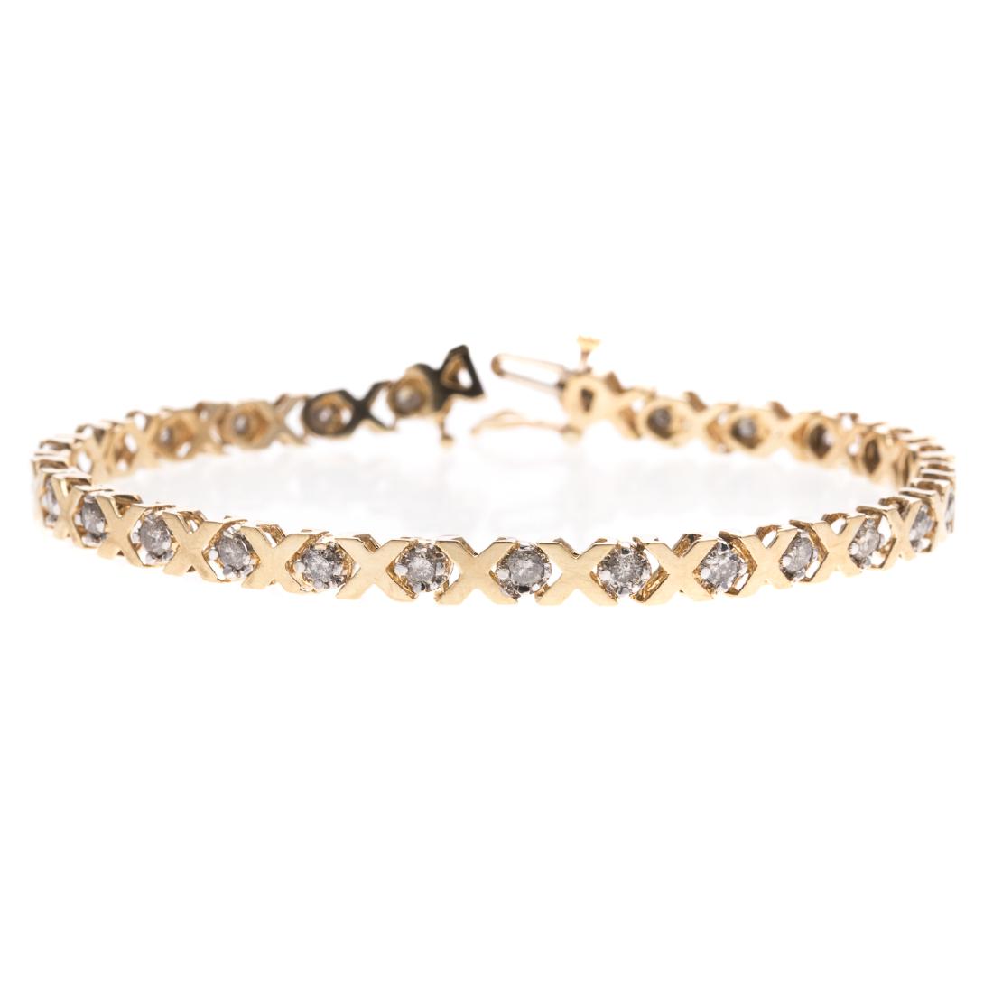 A Lady's Diamond "X" Link Bracelet in 10K Gold (1 of 3)
