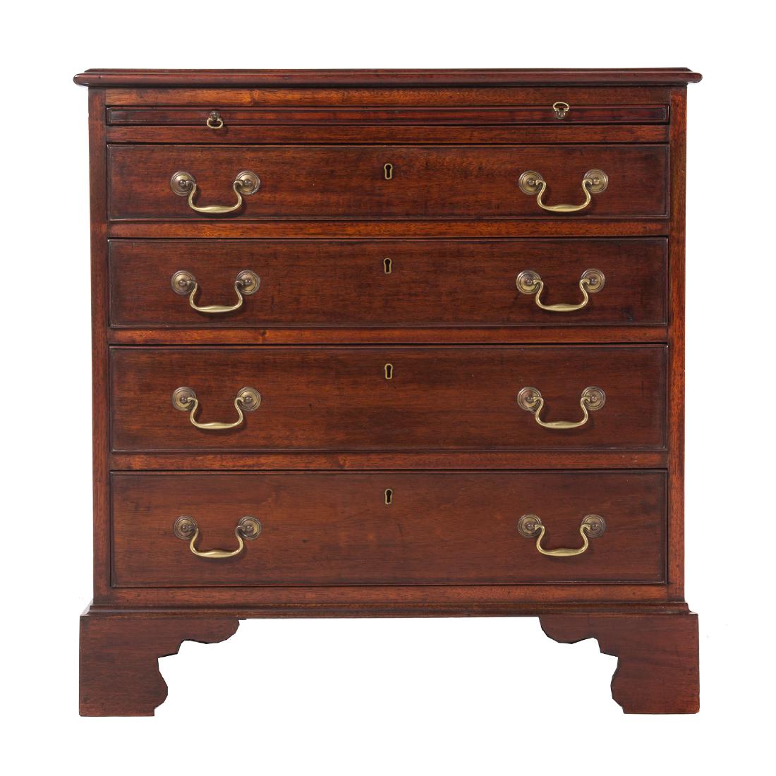 George III style mahogany bachelor's chest: 20th century; flat top with applied molded edge, brushing slide with four graduated drawers beneath, rosette and bail brasses, straight bracket feet, 30 in. H., 29 in. W., 16 1/2 in. D.