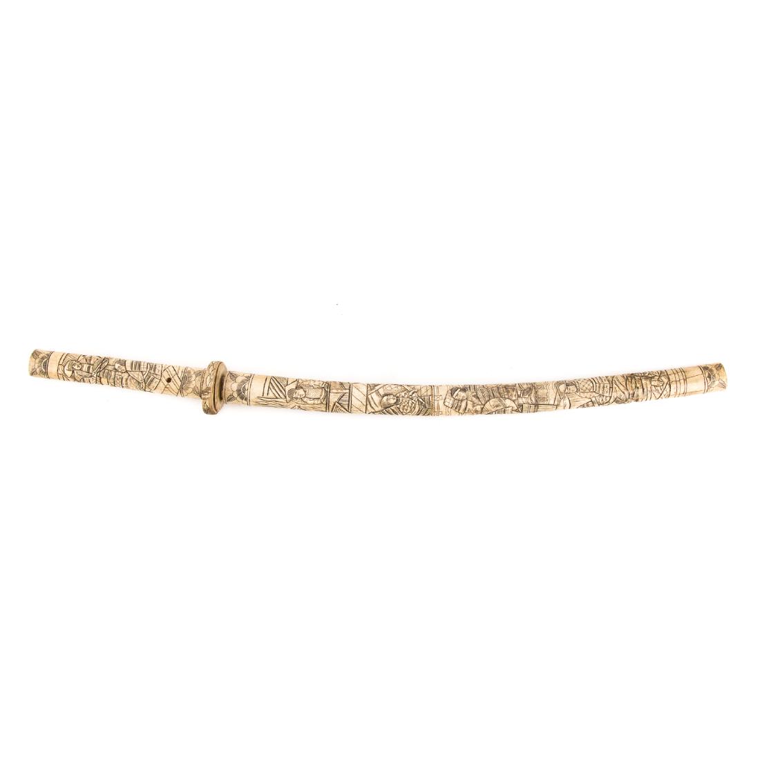 Japanese carved ox bone sword: early 20th century; decorative sword, with carved images of samurai on sheath and handle, 32 in. L.
