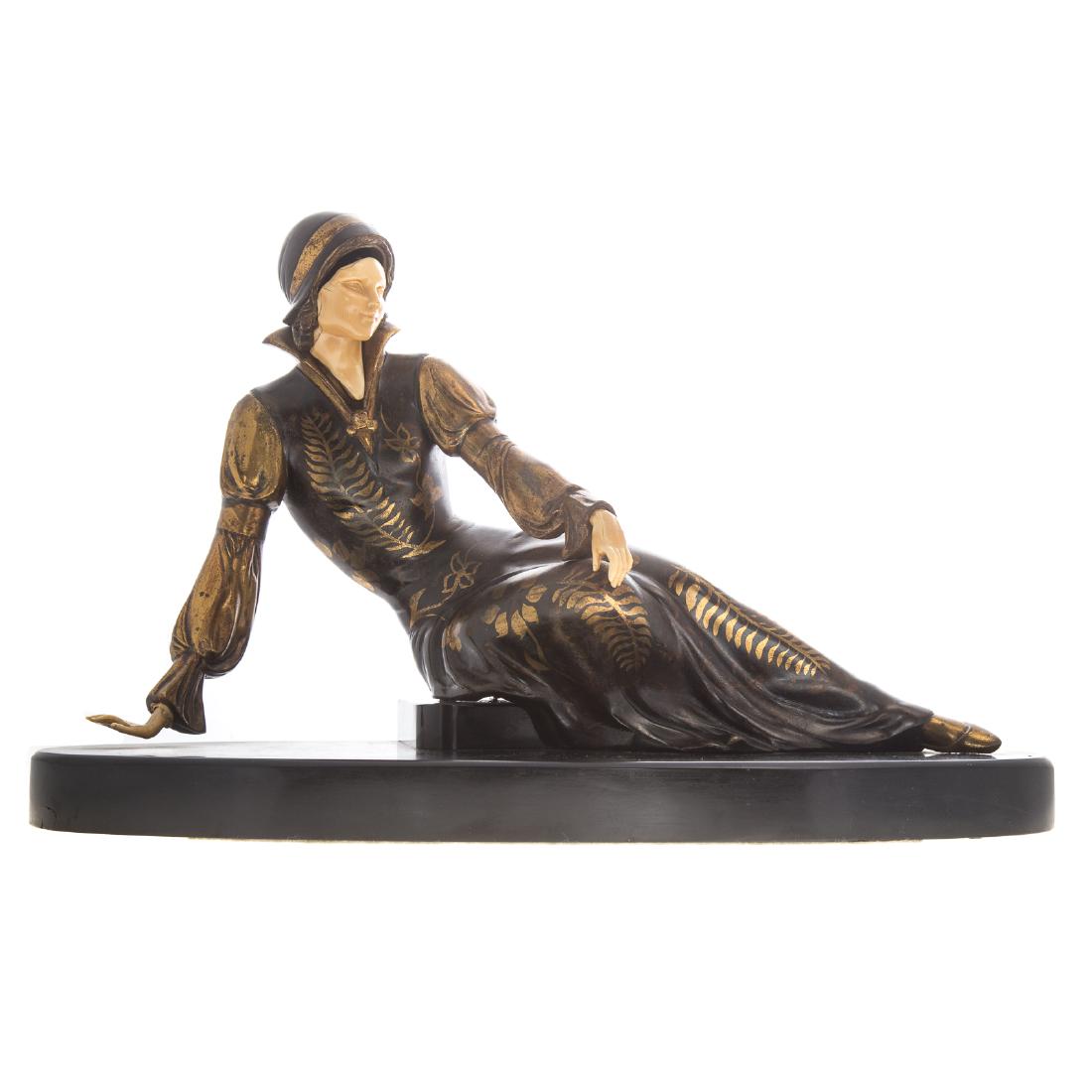 Ugo Cipriani. Art Deco woman figure: (Italian, 1887-1960). Spelter recumbent woman, with gilt decorated dress, ivorine flesh, signed Cipriani on base, mounted on black marble base, 12 in. H, 17 in. L.