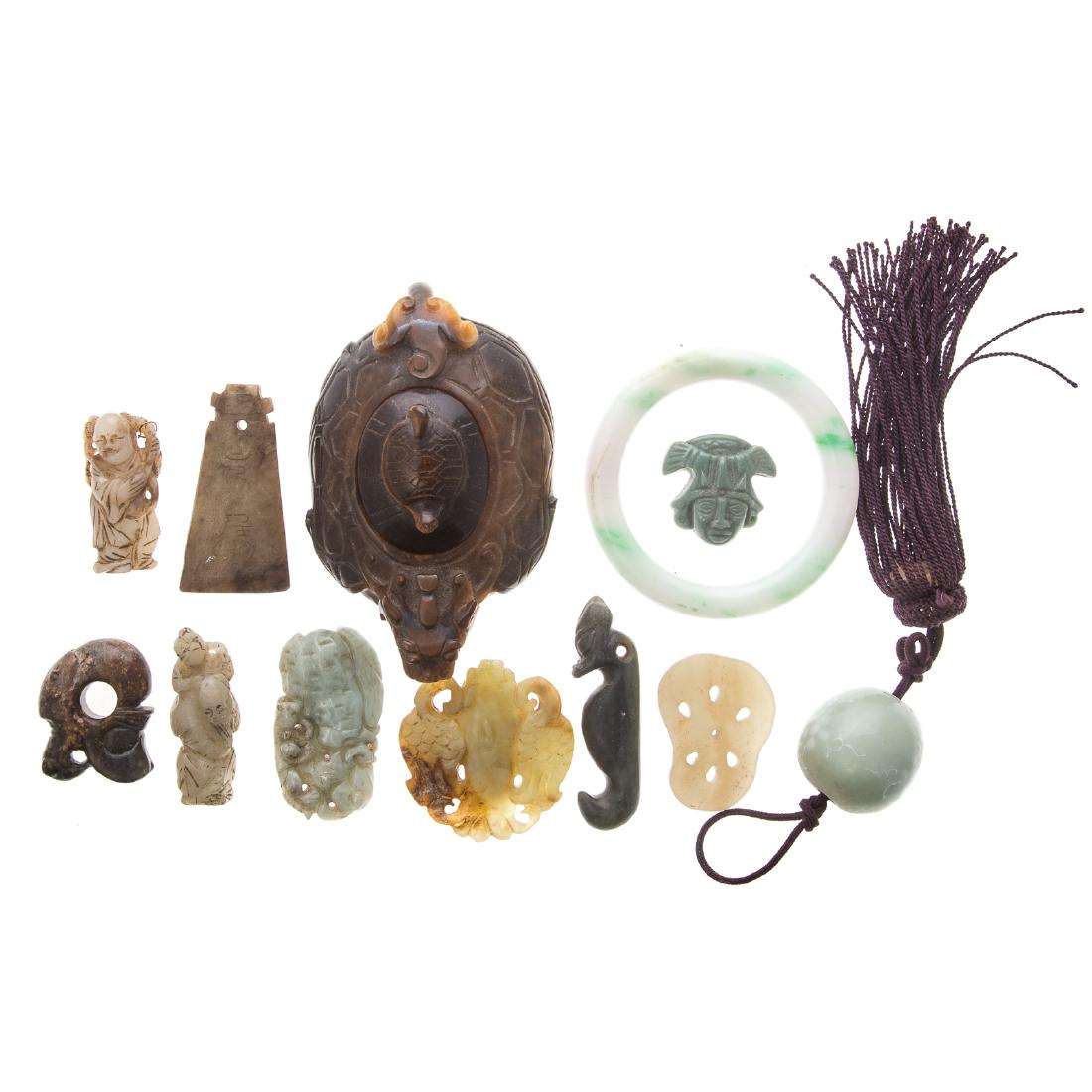 12 Chinese carved jade and hardstone objects: including; tiger's eye tortoise censer and assorted carved jade and hardstone bangles, amulets, buckles, and other objects