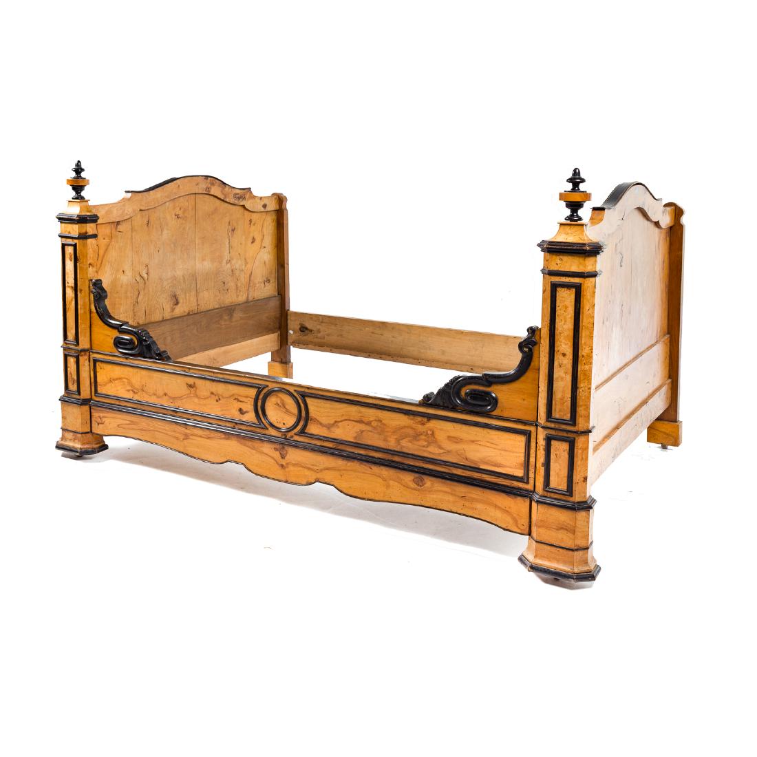 German burlwood & ebonized day bed: mid-19th century; turned finials, shaped crest rail on matching boards, one shaped and veneered railing, other in pine, molded block feet, wood casters, 47 in. H., 77 in. L, 51 in. W.