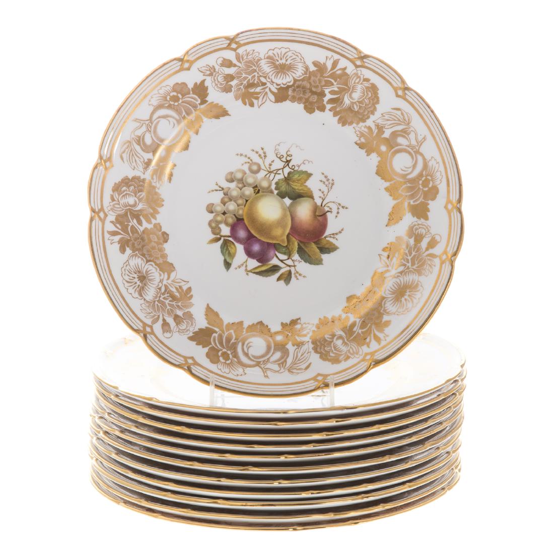 12 Spode bone china dinner plates: pattern Y7049, retailed Gered, Piccadilly Arcade, London, each centered with polychrome fruit motif, signed "M Edge," gilt fruit and floral border, gilt scalloped rim, 10 1/2 in. Diam.