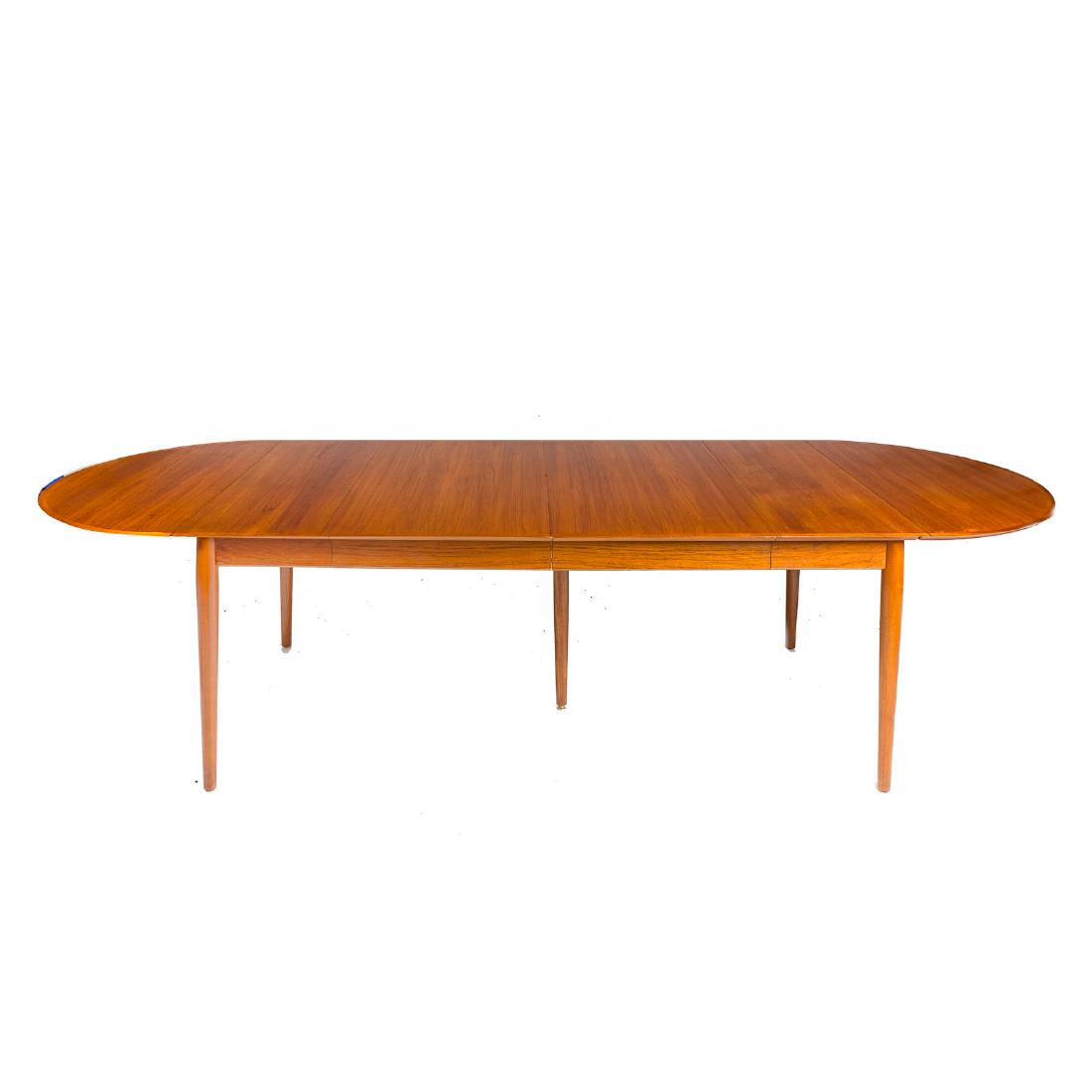 Arne Vodder Mid Century Modern teak dining table: Sibast, circa 1965; applied molded edge top, two 22 in. leaves, two 21 in. demilune drop leaves, 3 1/2 in. apron, circular tapered legs, 28 1/2 in. H., 114 in. L. (with all leaves) 41 1/2 in. W.