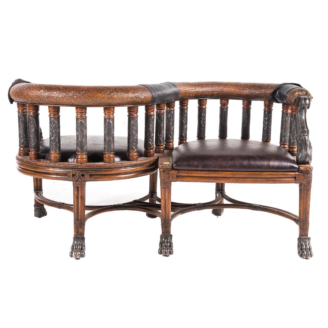 Maitland Smith caned tete-a-tete: 20th century; double leather upholstered seats connected by caned serpentine frame with scrolled cast metal arms, bamboo legs with cast metal animal paw feet, 30 in. H., 55 1/2 in. W., 24 in. D.