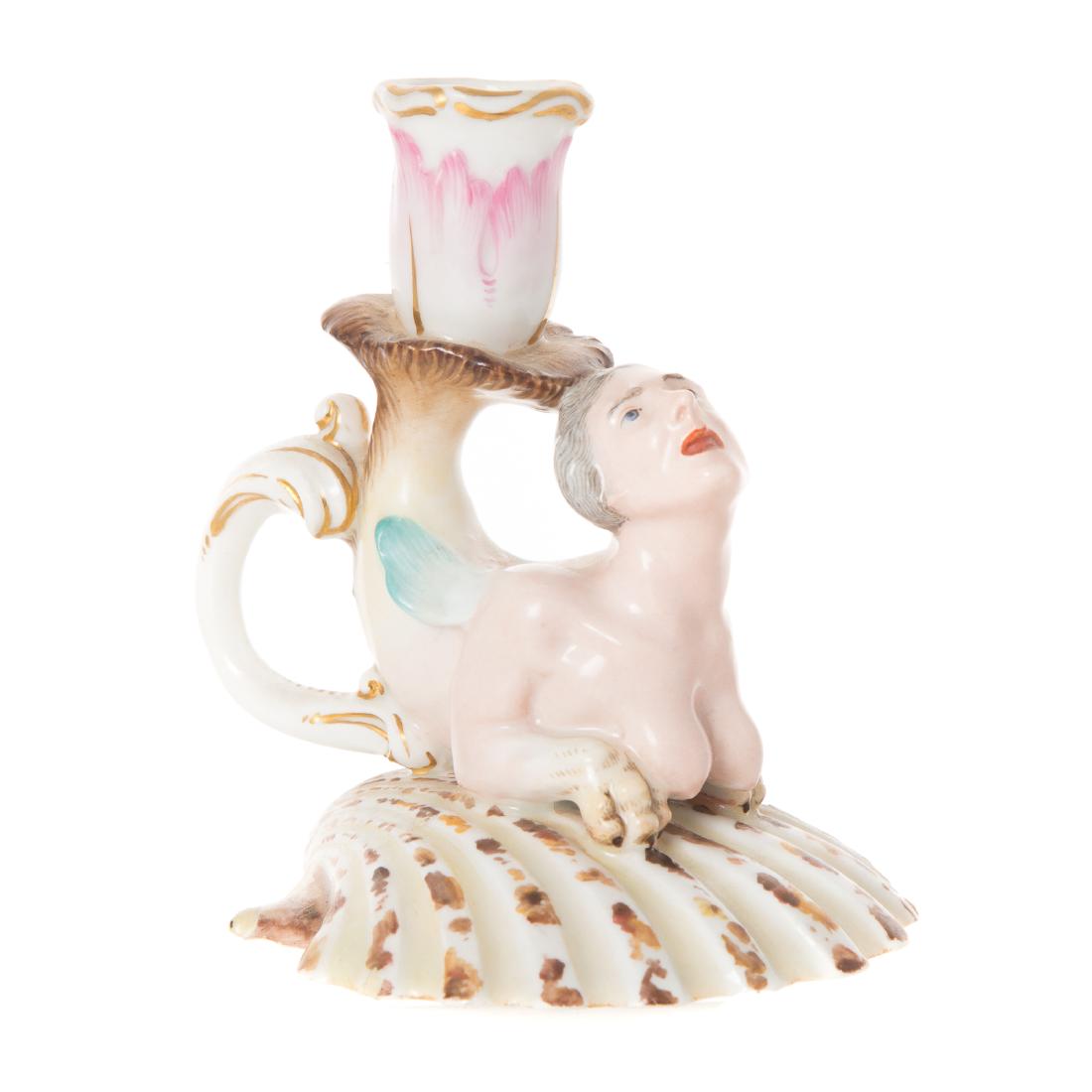 Unusual German porcelain figural chamberstick: late 18th century; grotesque female nereid on clam shell base, with tail supporting candle socket and applied handle, 5 in. H.; Estate of Dr. William M. King, Fort Lauderdale, FL.