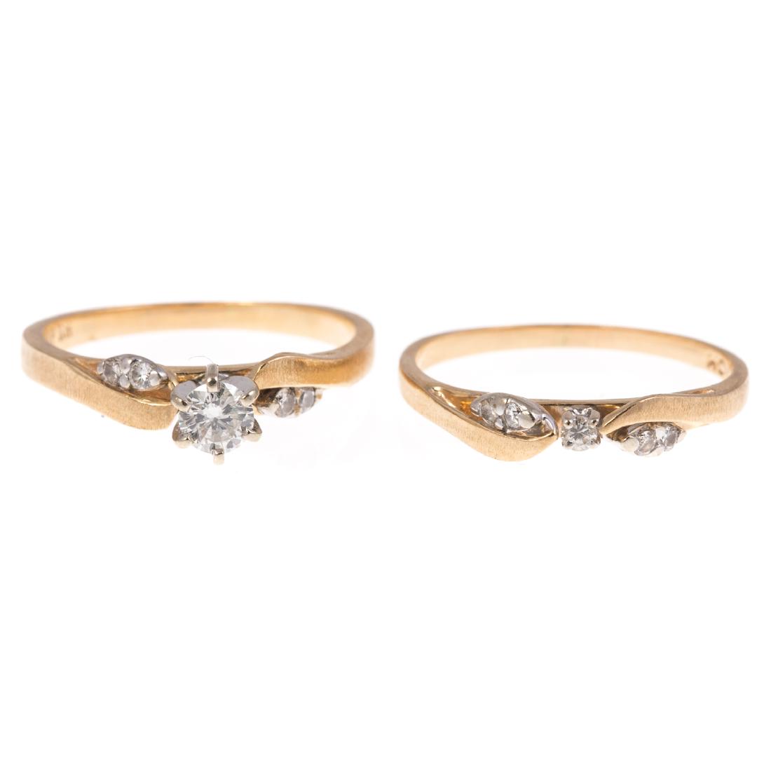 A 14K Diamond Engagement Ring & Wedding Band: 14K yellow gold matching wedding set with round diamond in the center and smaller diamonds on the side, approx. 0.50 ctw, 4.8 grams