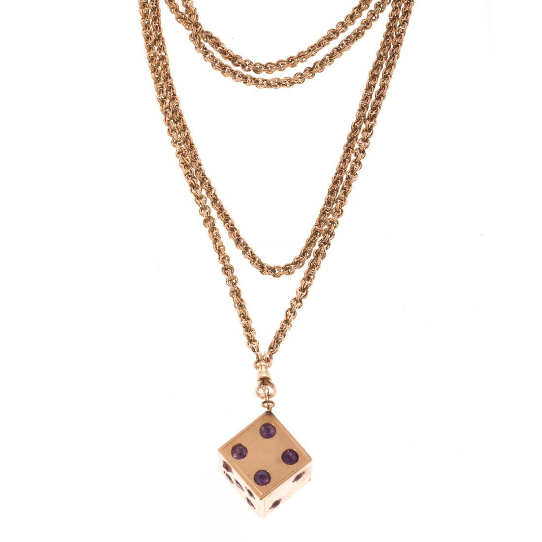 A Ladies Large Dice Pendant on Long Chain in 14K