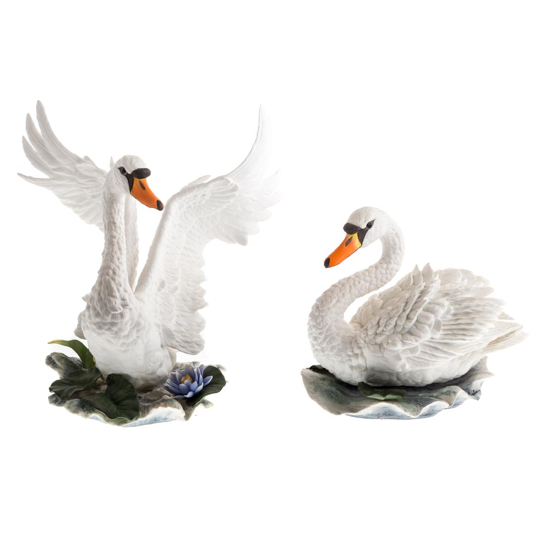Pair Boehm porcelain Mute Swans: with printed marks, numbers 40343 and 40346, male limited edition no. 52, female limited edition no. 47, 11 1/4 in. H to 15 3/4 in. H