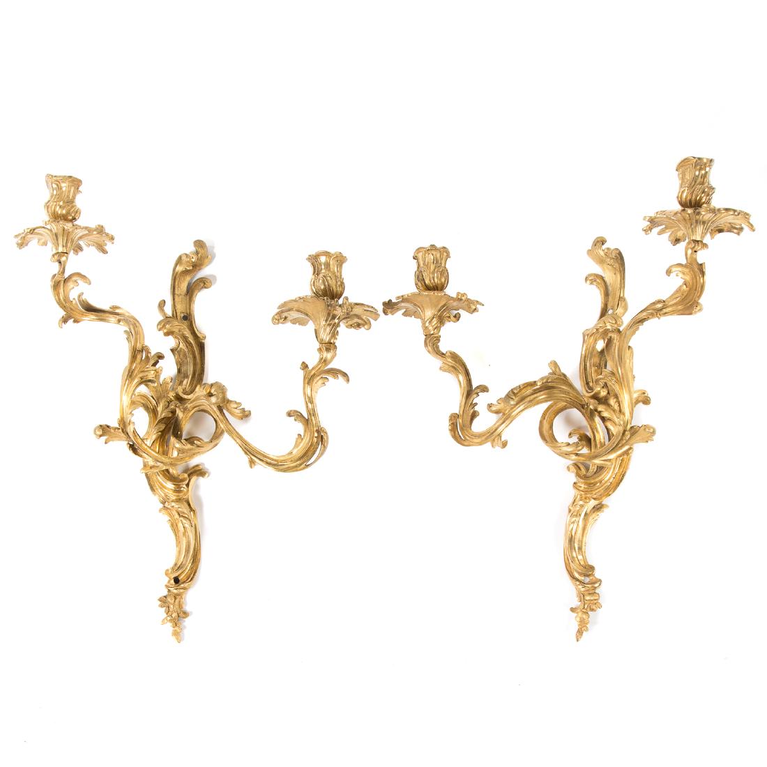 Pair Louis XVI style gilt bronze two light sconces: early 20th century; acanthus form branches and back, 20 in. H., 16 in. W.