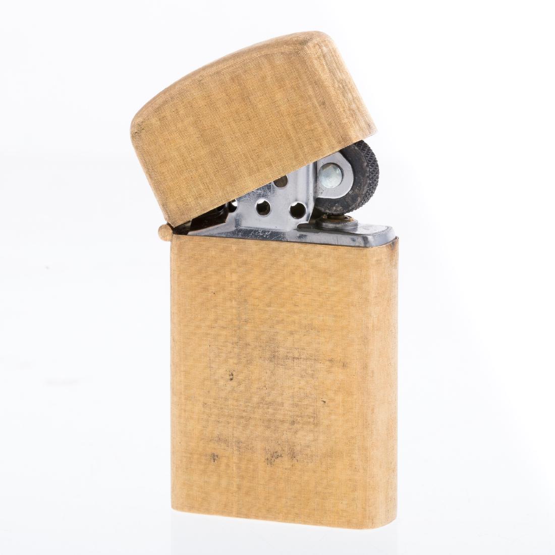A Buccellati Zippo Lighter in 18K: 18K yellow gold lighter, hallmarked M. Buccellati, in the renowned crosshatched texture, satin finish, 2.20 in. L, x 1.15 in. W, 50.6 grams tw