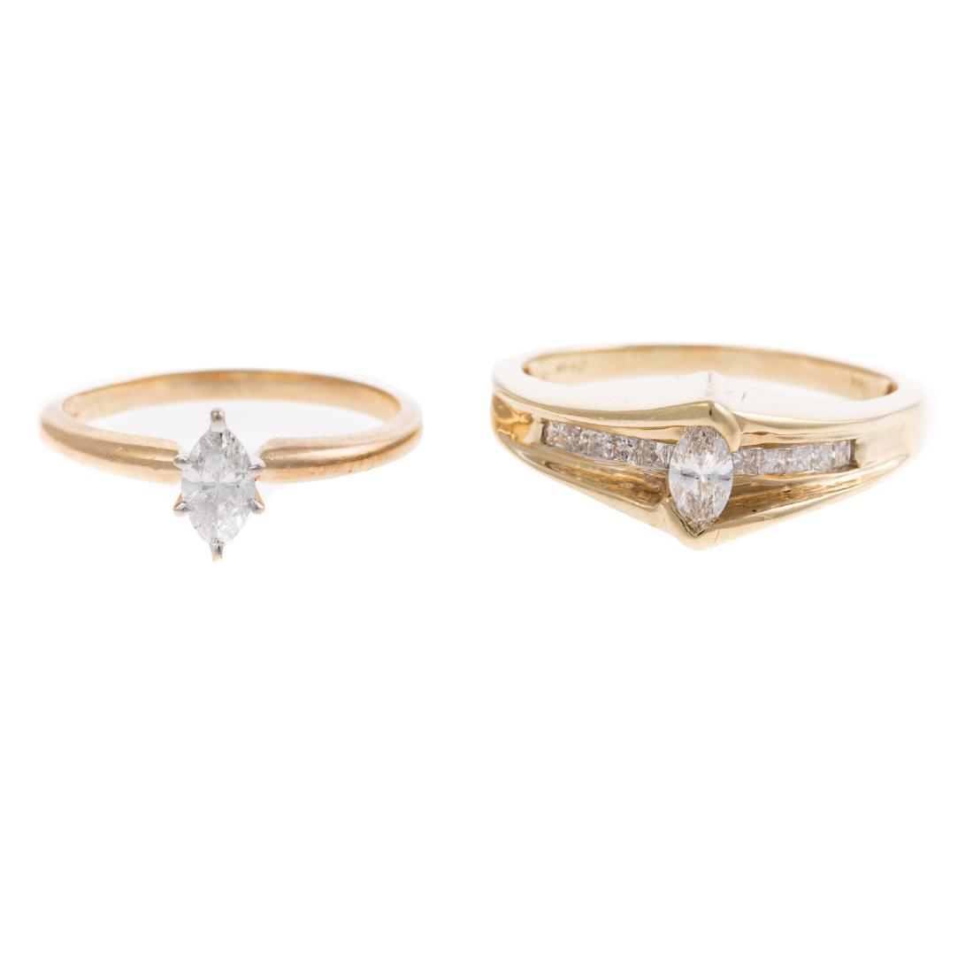 A Pair of Marquise Diamond Rings in Gold: 1) 14K yellow gold engagement ring featuring marquise cut diamond weighing approx. 0.25 ct in the center with channel set princess cut diamonds in band, sz 8.75 and 2) 14K yellow gold solitaire engage