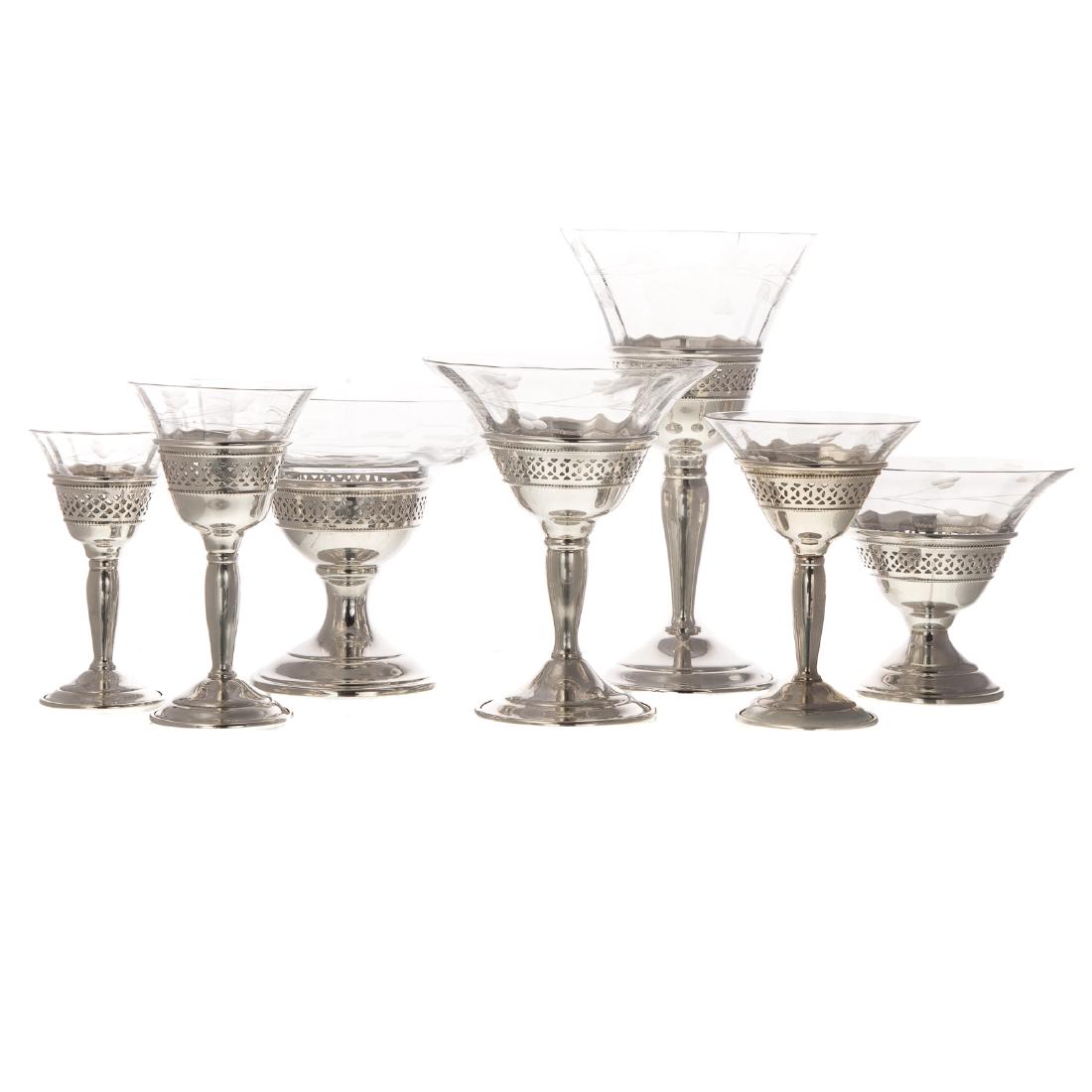 Collection of Crystal Stemware with Sterling Bases: 84 pieces, most by Redlich & Co., New York, NY (1895-1946), comprising: champagne glasses, wine glasses, cordials, sherbets and others, no monograms, size range-3 1/2 to 7 in. H., silver approx. 103.2