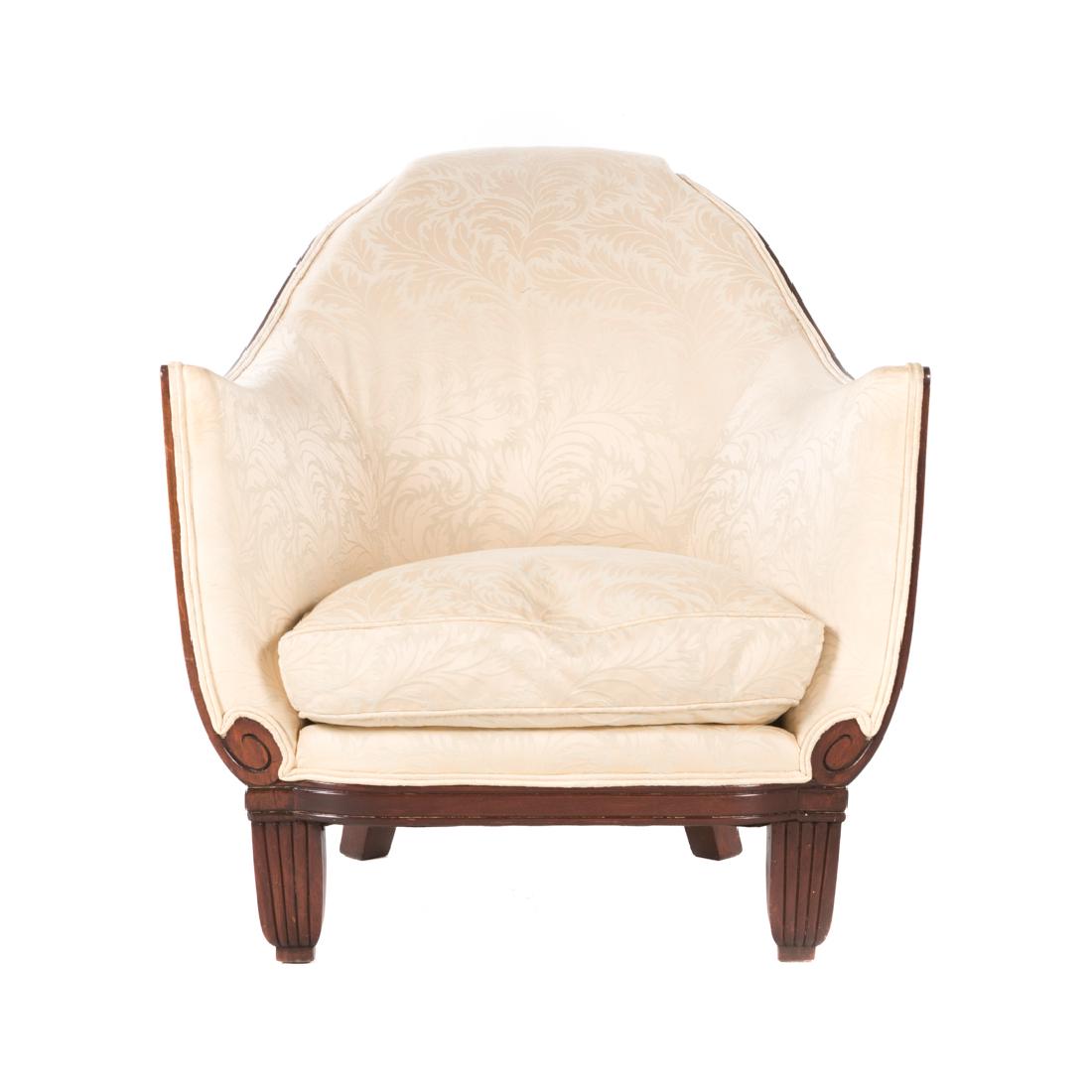 French Art Deco Upholstered Bergere: circa 1930; exposed frame, raised curved upholstered back and arms, loose seat cushion, reeded block feet, 30 1/2 in. H., 29 1/2 in. W., 30 in. D.