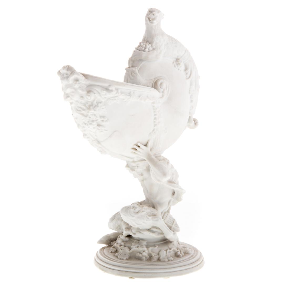 Meissen Bisque Porcelain Figural Salt Cellar: late 19th century; nautilus bowl with satyr mask topped by leopard, supported by kneeling satyr surrounded by grapevines, 10 in. H.