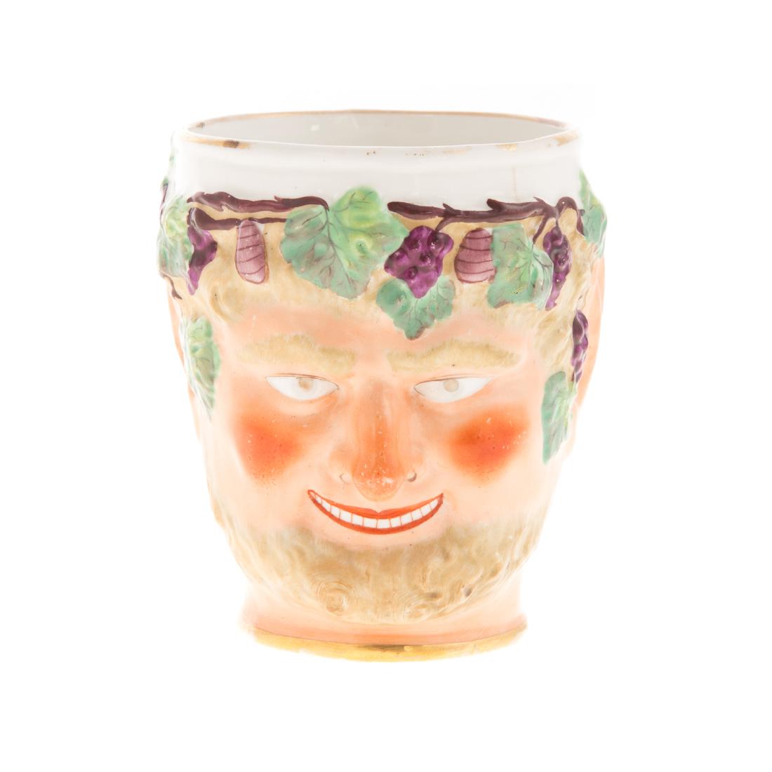 Derby China Satyr Head Mug: circa 1820; painted face and grapevine decoration, 3 1/2 in. H.; Estate of Dr. William M. King, Fort Lauderdale, FL.