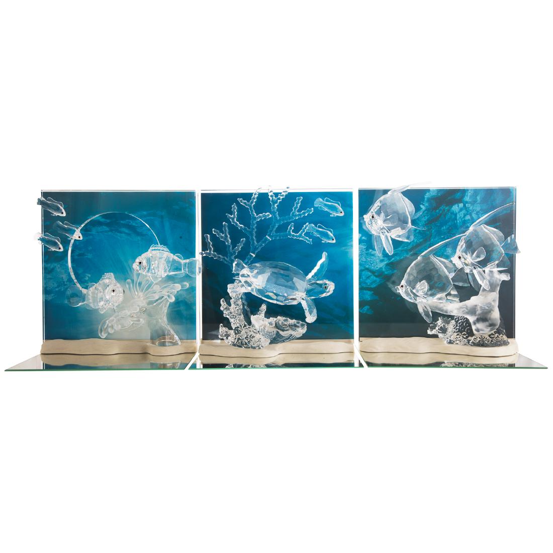 Three Swarovski Wonders of the Sea Dioramas: each with cut and molded crystal exotic fish, sea turtle and reef plants, with plastic stand, cardboard background and mirror plateau base, "Community," "Harmony," and "Eternity" in original boxes, ea