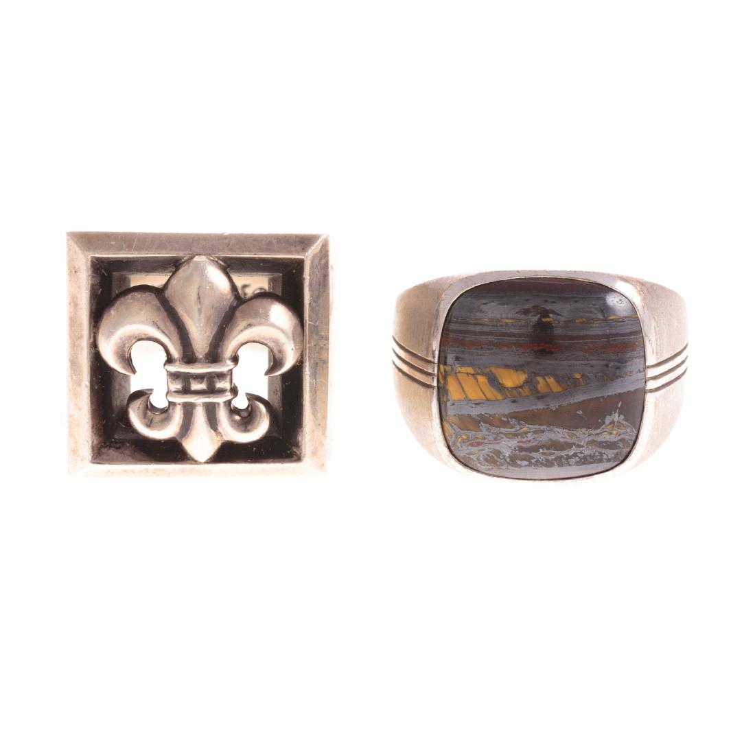 Two Gent's Rings by Tacori and Chrome Hearts: 1) Sterling silver Tacori ring featuring a bezel set, banded agate stone, with scalloped edging, sz 11, and 2) sterling silver, heavy custom made Chrome Heart ring featuring a fleur-de-lis, marked 200