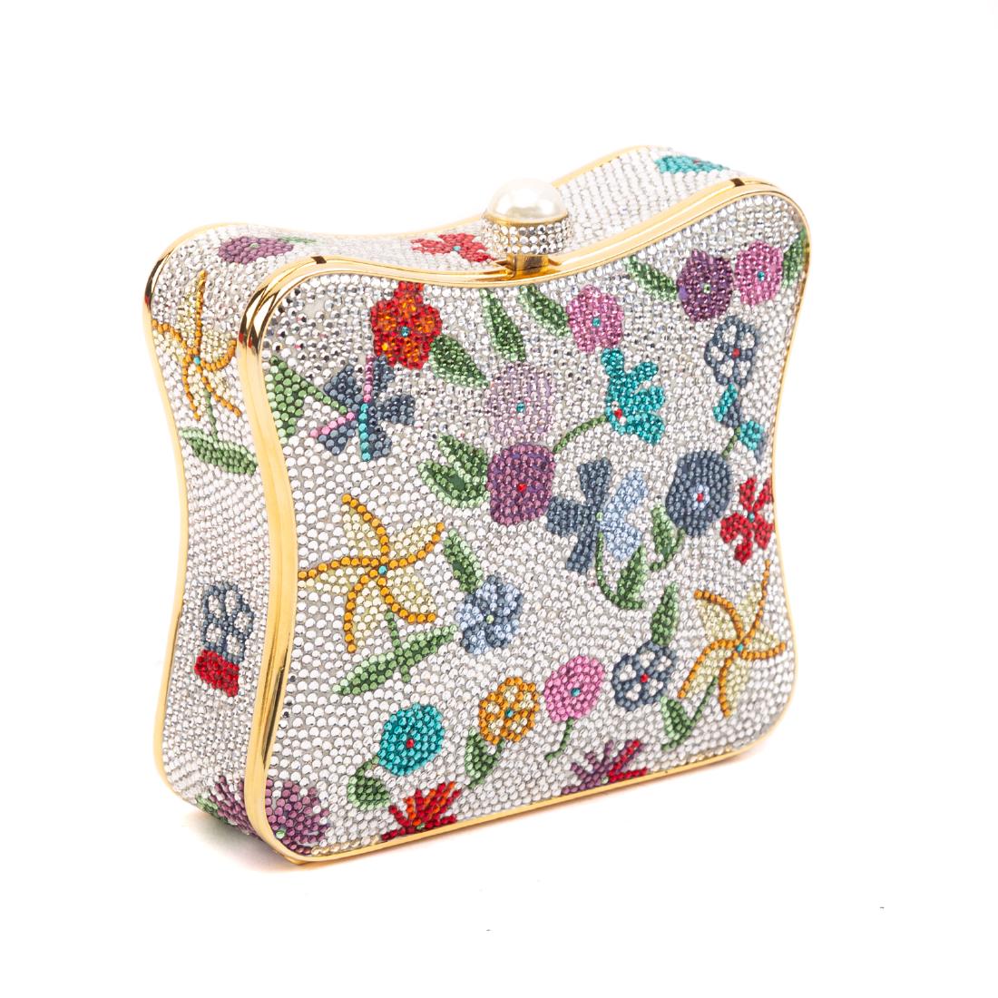 A Judith Leiber Floral Embellished Minaudière: Silver and multicolor crystal-embellished Judith Leiber minaudière with gold-tone hardware, single drop-in chain shoulder strap, floral crystal embellishments throughout with curved edges, metallic g