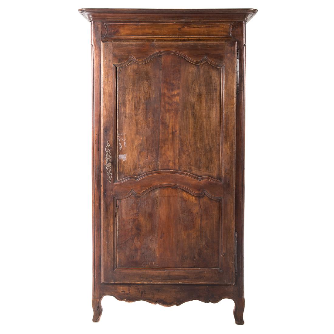 Country French Carved Walnut Bonnetiere: 18th century and later, flat molded cornice, compartment with shelving enclosed by single paneled door, shaped apron, cabriole legs, 75 in. H., 42 in. W., 24 in. D.
