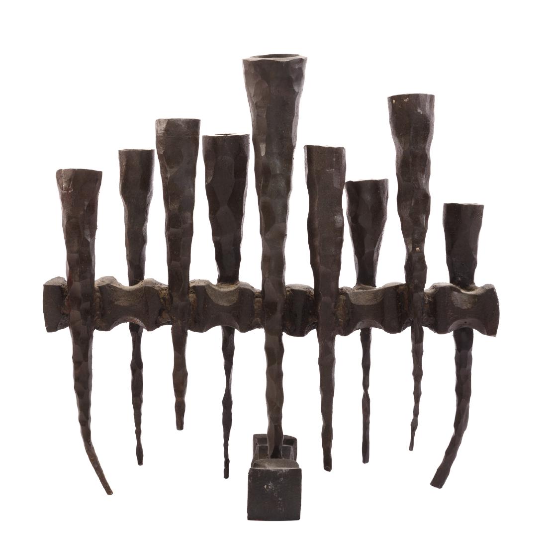 Attributed David Palumbo. Brutalist Iron Menorah: (American, 1920-1966). Forged iron abstract ceremonial candelabra, 14 in. H., 14 in. W.