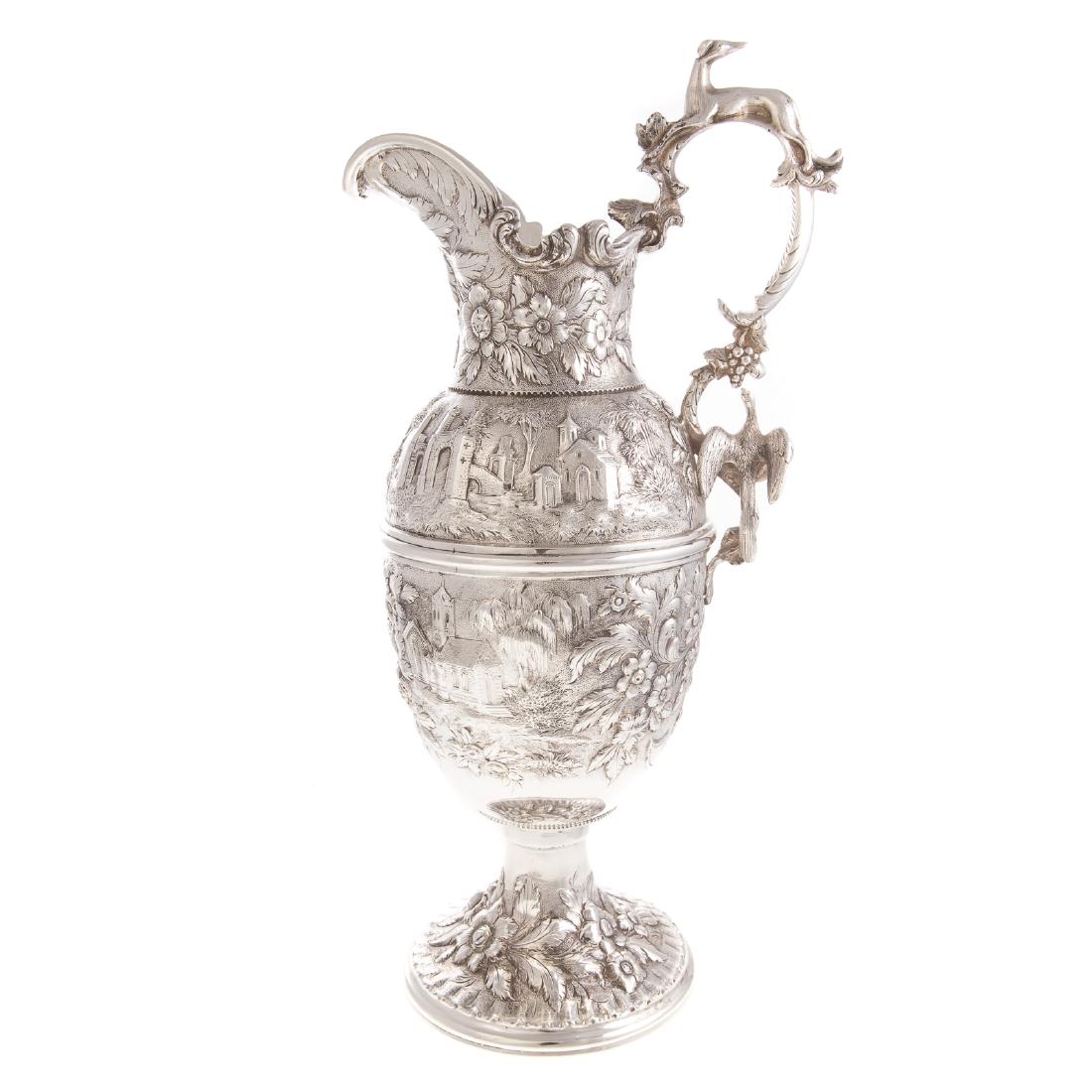 Beautiful Kirk Castle Landscape Coin Silver Ewer: Unusual Kirk Castle Landscape repousse coin silver ewer, circa 1846, handle with 3-dimensional grey hound and bird decoration, 17 1/2 in. H. over handle, 78.0 ozt.