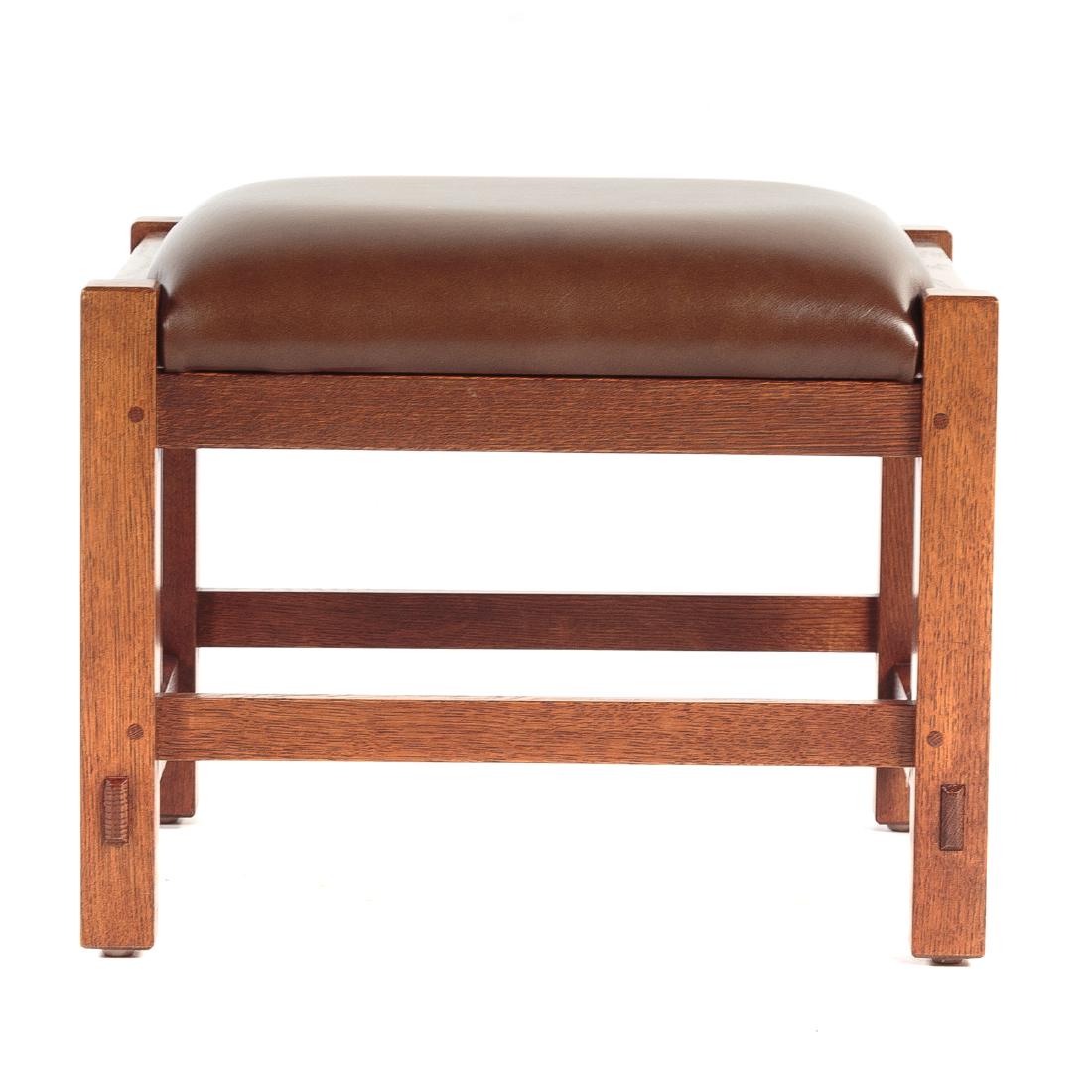 L & G Stickley Mission Style Foot Stool: 20th century, exposed frame, leather upholstered cushion, squared legs with exposed through tenons connected by stretchers, 15 1/2 in. H., 19 in. W., 15 in. D.