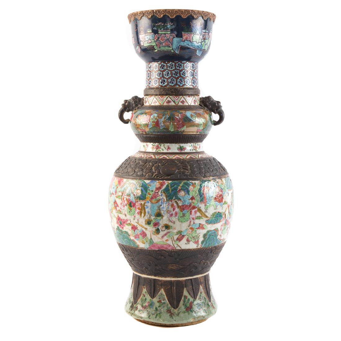 Large Chinese Export Famille Rose Vase: second half-19th century; large central Famille Rose band depicting warriors and similar smaller band with brown relief decorated bands and celadon base, double elephant head handles, 24 in. H.