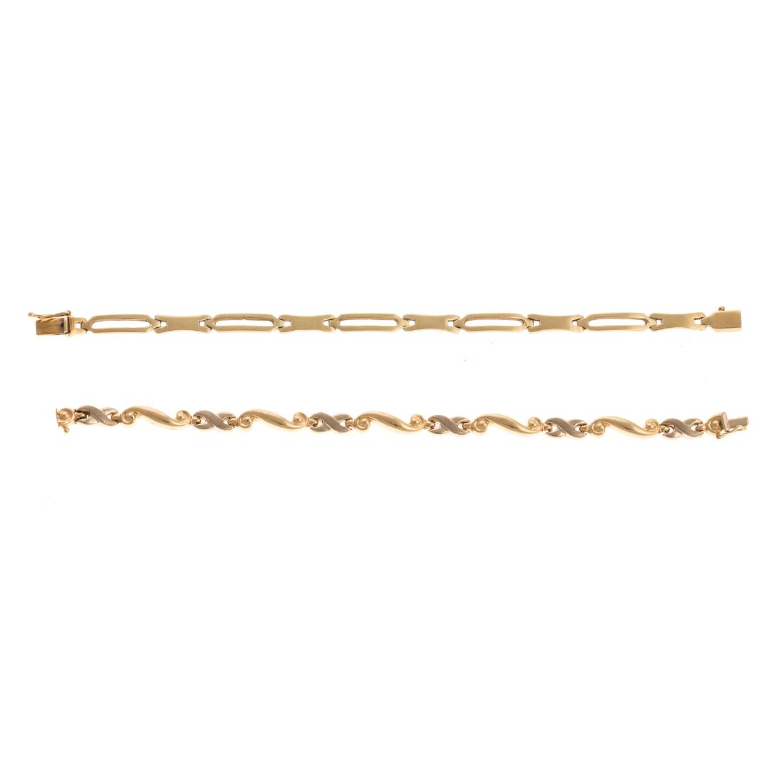 A Pair of Ladies Link Bracelets in 14K: 1) 14K yellow gold wave and "X" link bracelet with high polish finish, hidden box clasp and figure 8 safety, 7 in. L and 2) 14K yellow gold open rectangular link alternating with a high polished link,