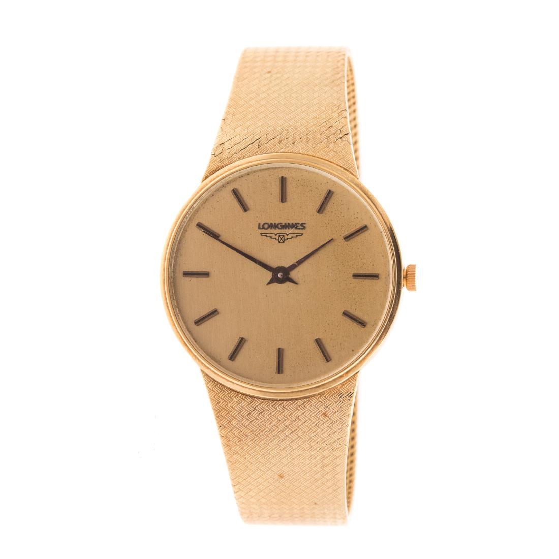 A Gentleman's Longines Watch in 14K Gold: 14K yellow gold Longines Swiss dress watch, flat braided Italian band, round gold dial, stick numerals, fold over clasp, 7.5 in. L, 57 grams
