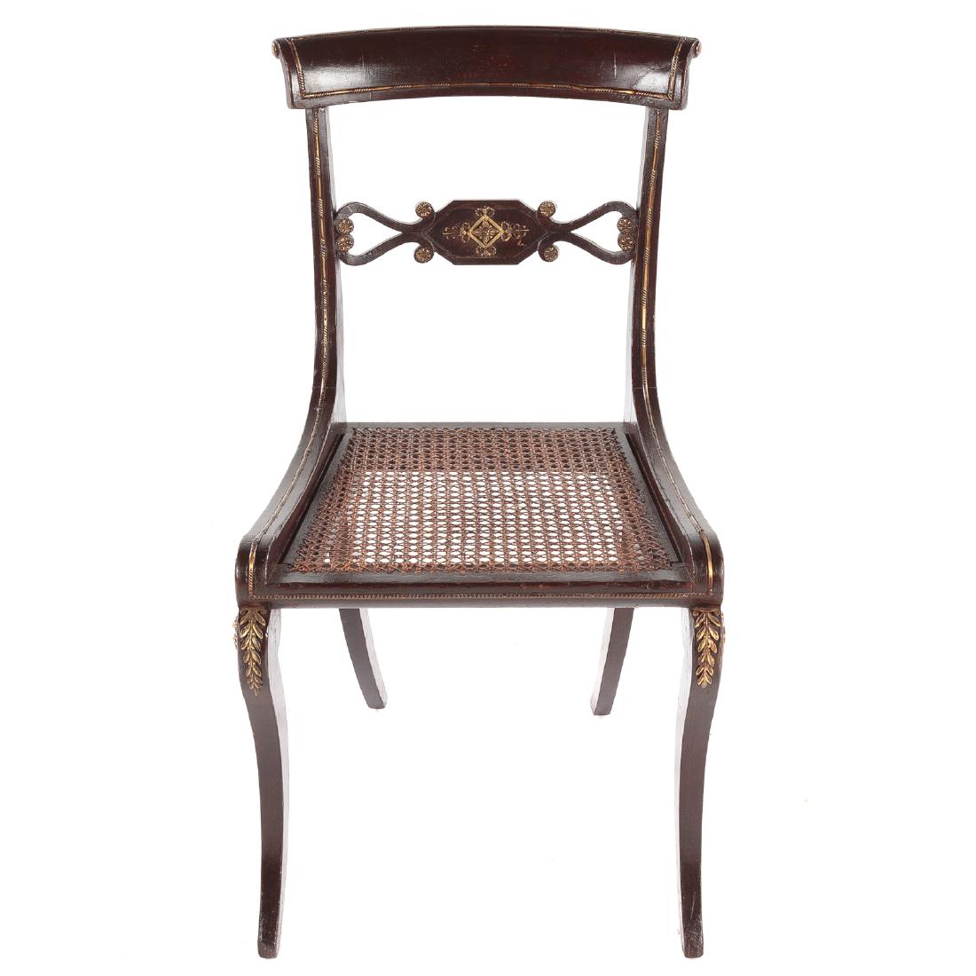 Regency Ebonized Side Chair: circa 1815, curved tablet form crest rail, openworked brass mounted horizontal splat, caned seat, sabre legs, brass mounts, 33 in. H., 18 1/4 in. W., 19 in. D.; Estate of a Prominent Washington, DC An