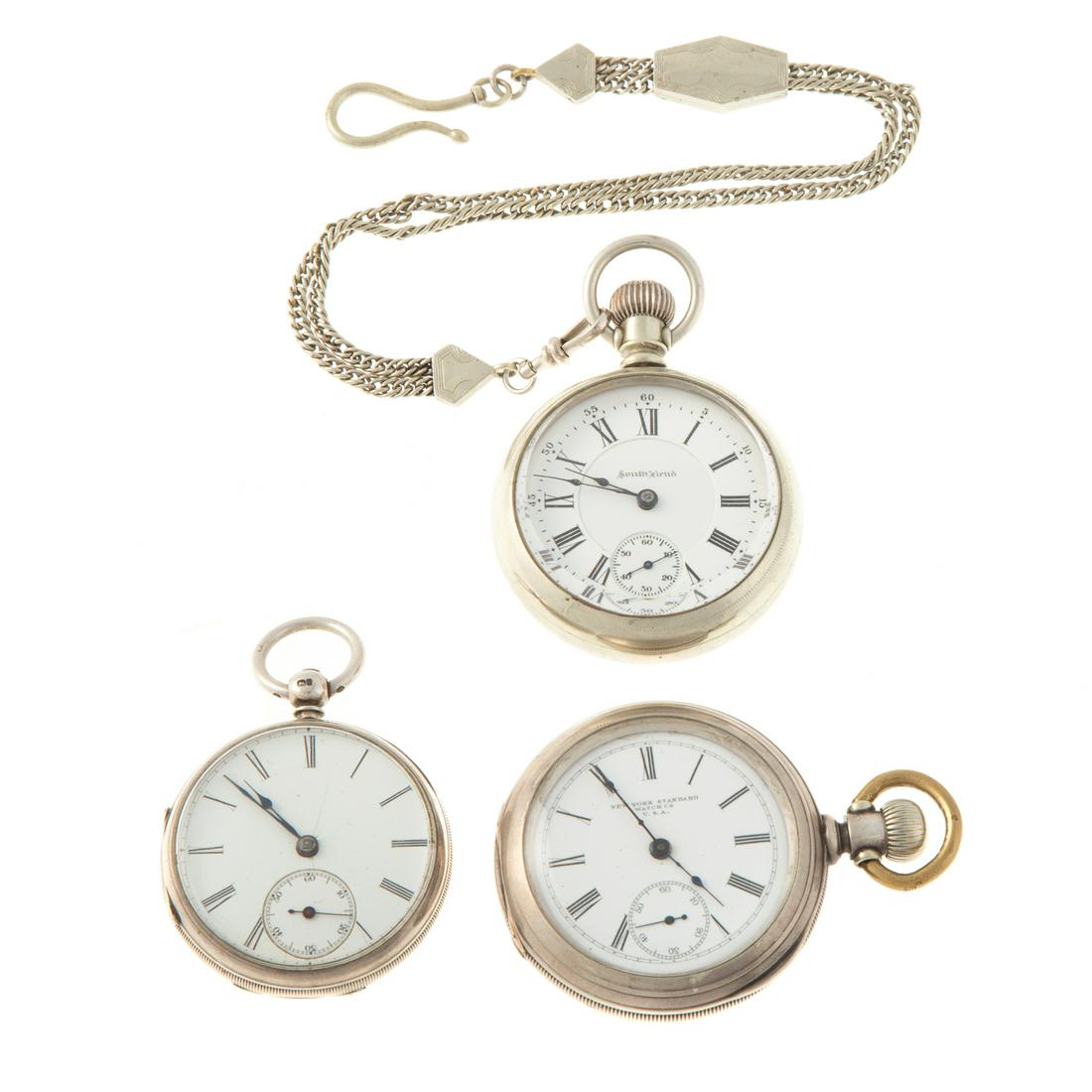 A Trio of Pocket Watches Featuring Skeleton Back: 1) c. 1907 silver South Bend pocket watch, mechanical, sub dial, Roman numerals beveled crystal, suspended from a vintage silver pocket watch chain, 2.25 in. D, 2) silver English open face pocket watc