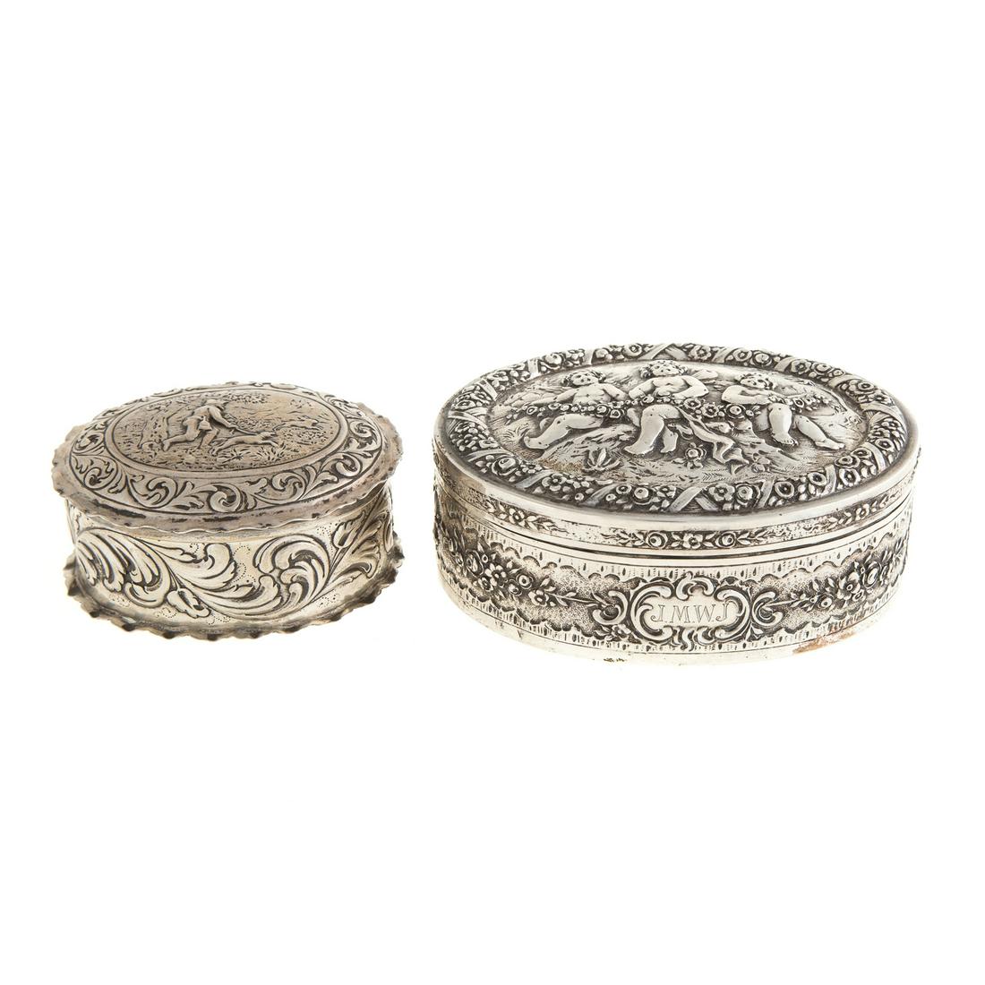 German Silver Jewelry Box & Snuff Box: early 20th century, both oval-form, 1) German silver jewelry box of oval-form, embossed with floral and scroll decoration, hinged cover embossed with winged putti and garland, monogrammed "J.M.W.J." o