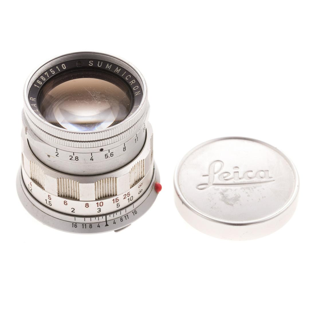 Leica Summicron Lens: dated 1961; 1:2/50, serial # 1887510, with Leica stamped aluminum lens cover