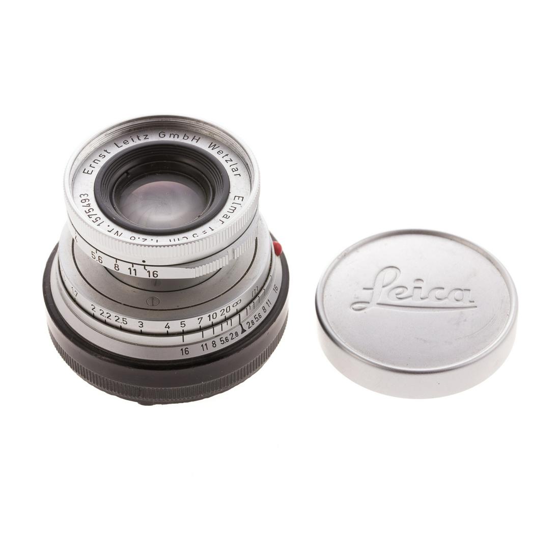 Leica Elmar Lens: dated 1957; 1:2.8: serial # 1575493, with stamped aluminum Leica lens cover