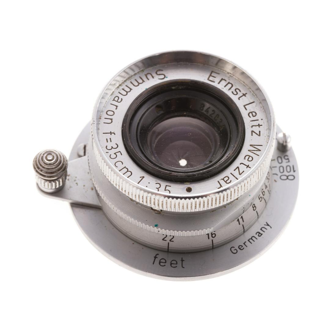 Leica Summaron Lens: dated 1951:1:3.5, serial # 842834, in Leitz plastic storage container