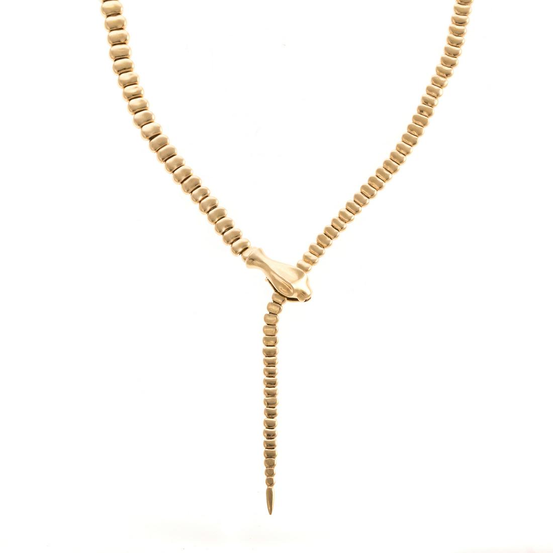 A Tiffany & Co. Peretti Snake Necklace in 18K: 18K yellow gold snake necklace by Elsa Peretti for Tiffany & Co interlocking bean links to create articulating snake with clasp in the snakes mouth, adjustable length up to 20 in. current retail $13,0