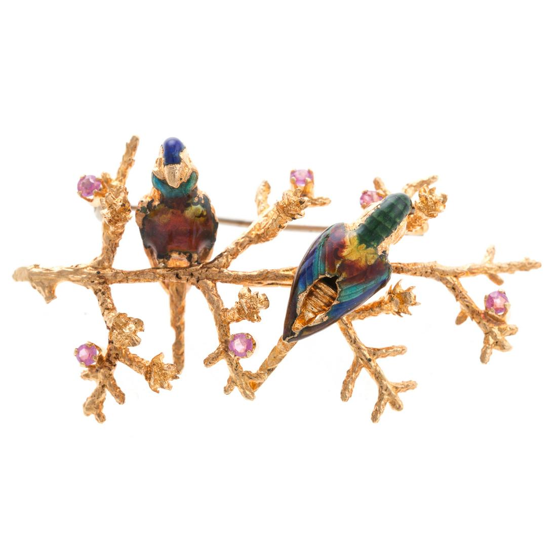 A Ladies Vintage Enamel Brooch with Birds in 18K: 18K yellow gold brooch featuring a pair of multi colored enamel birds on a textured branch highlighted with 6 round faceted pink stones, 2 in. L, 11.3 grams