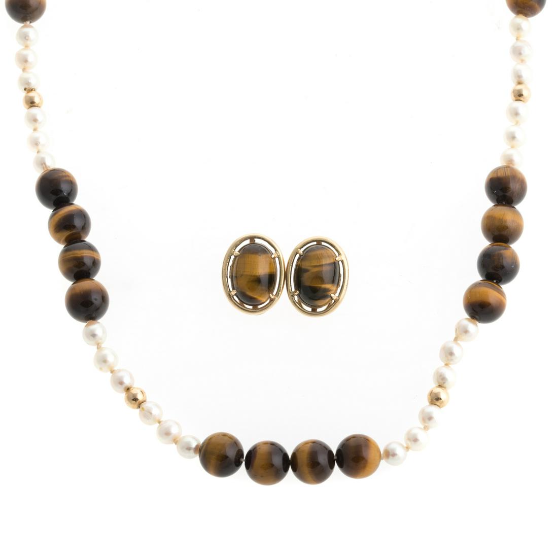 A Pair of 14K Tiger's Eye Earrings & Necklace: 1) 14K yellow gold oval earrings featuring oval tiger's eye measuring 13 x 18,, set with wide gold frame, Omega clip backs, 1 in. L, 12.9 grams and 2) beaded necklace featuring an alternating pattern 