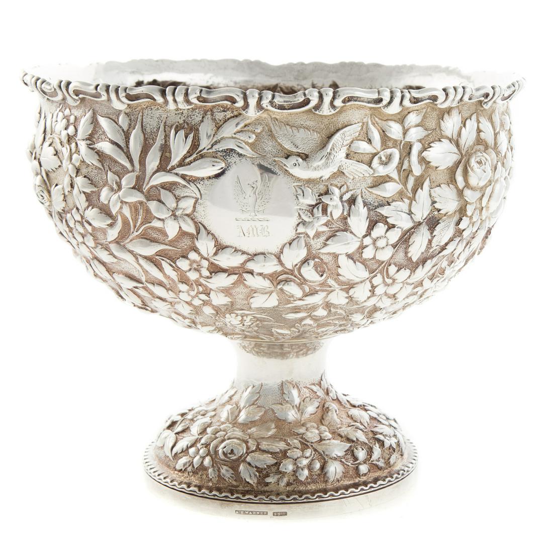 A. E. Warner Sterling Silver Repousse Center Bowl: mid-19th century, 11-2 sterling mark, model 112, on pedestal foot, floral and fruit repousse, armorial and "AMB" monogram, 7 in. H by 8.25 in. D, 26.8 ozt.