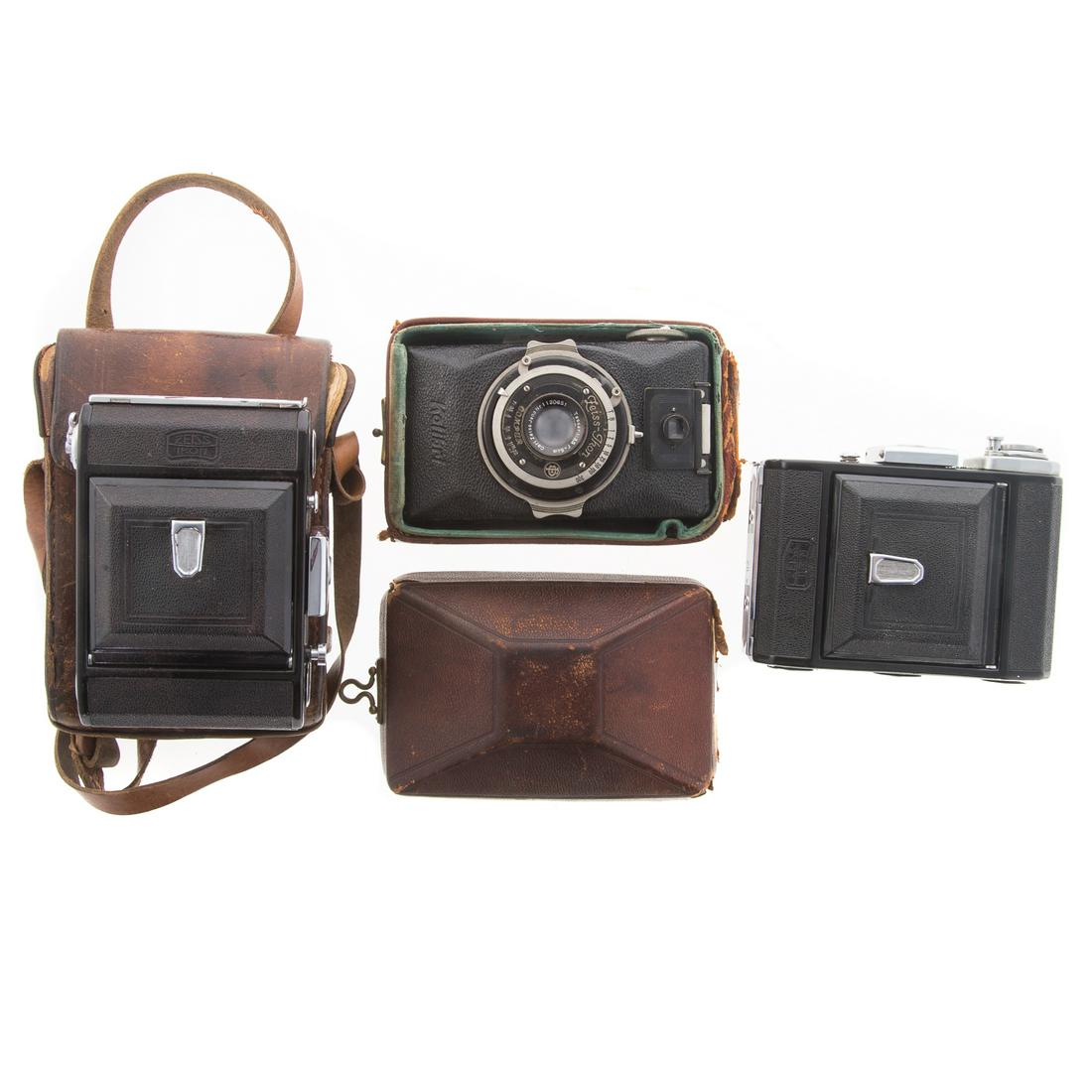 Two Zeiss Novar Anastigmat & Compur Cameras: Novar Anastigmat folding camera with Zeiss 1:4,5 lens, Novar Anastigmat folding camera with Zeiss 1:6,3 lens and leather carrying case and Zeiss Ikon Compur camera with Tessar lens 1:3,5 , serial # Nr